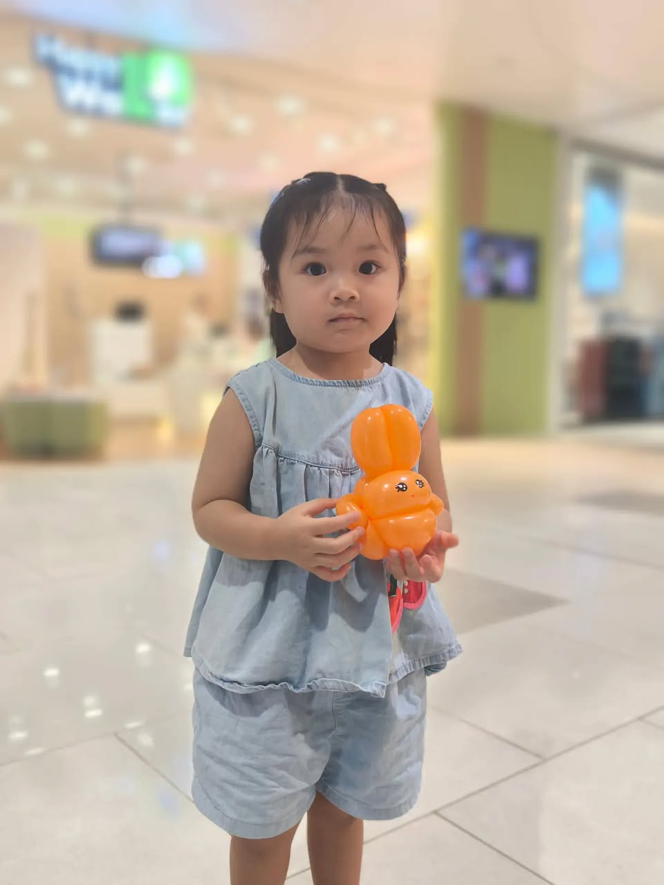 Child with balloon creation at Compass One