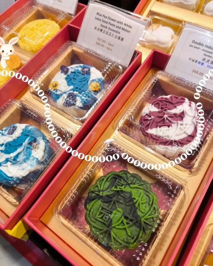 Blue pea flower snowskin mooncakes in red gift boxes with price tags